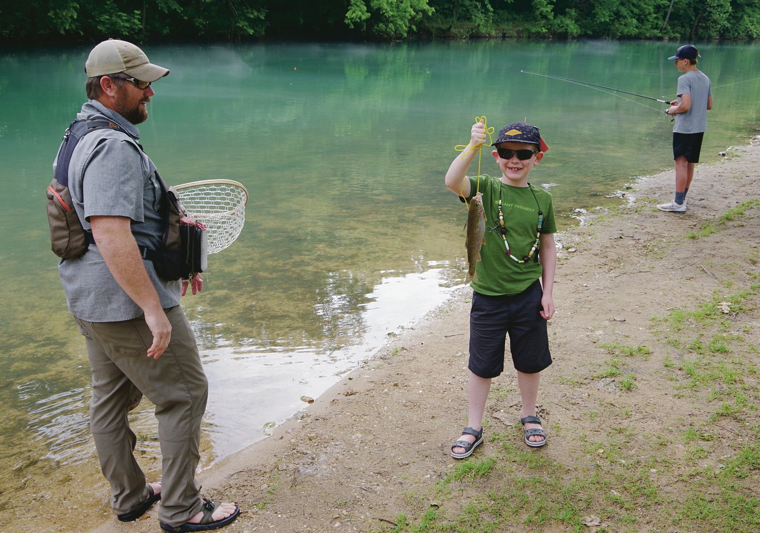 Between helping student detangle their lines and tie on different lures, Ryne Emerick, LHS science teacher and co-teacher of Explorer Camp at Bennett, gave his son, Edward, 8, some trout catching family secrets. Edward landed two very quickly by fishing in the shallow water.
