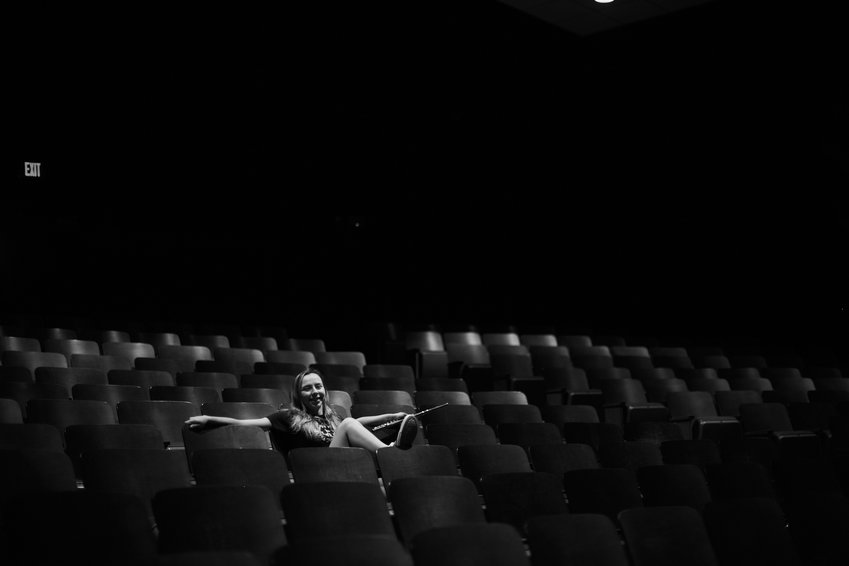 Carolyn England poses with her flute in the auditorium of Chatham Central High School.