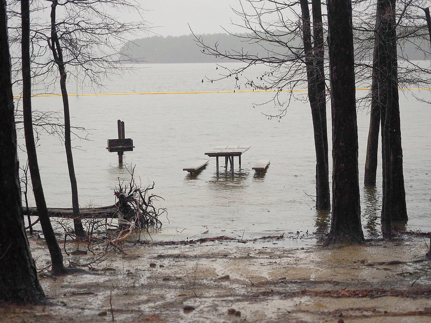 The waters of Jordan Lake are again rising due to rains. Picnic tables at White Oak are again under water.