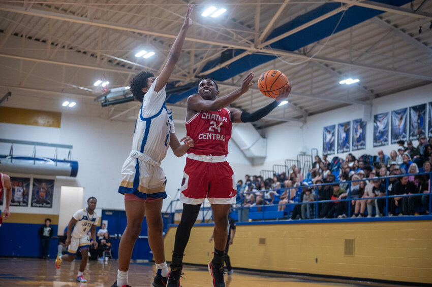 Chatham Central&rsquo;s Devonte' Johnson shoots against Jordan-Matthews' Zaeon Auguste during the Bears&rsquo; win over the Jets to complete a season sweep.