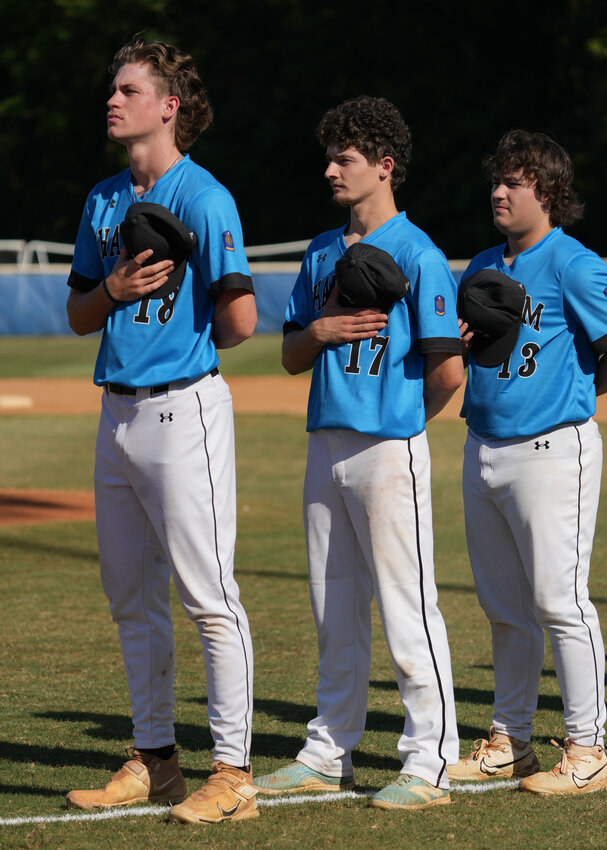 Lopossay (17) stands for the national anthem before a game this past season.