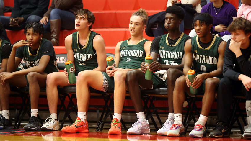 Northwood&rsquo;s bench looks on during a game against Graham last season. The Chargers will be hosting some of the state&rsquo;s top teams in a basketball showcase in December.