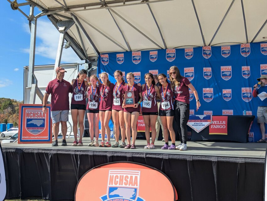 Seaforth&rsquo;s girls&rsquo; cross-country team poses for a photo after taking second place at the state meet.
