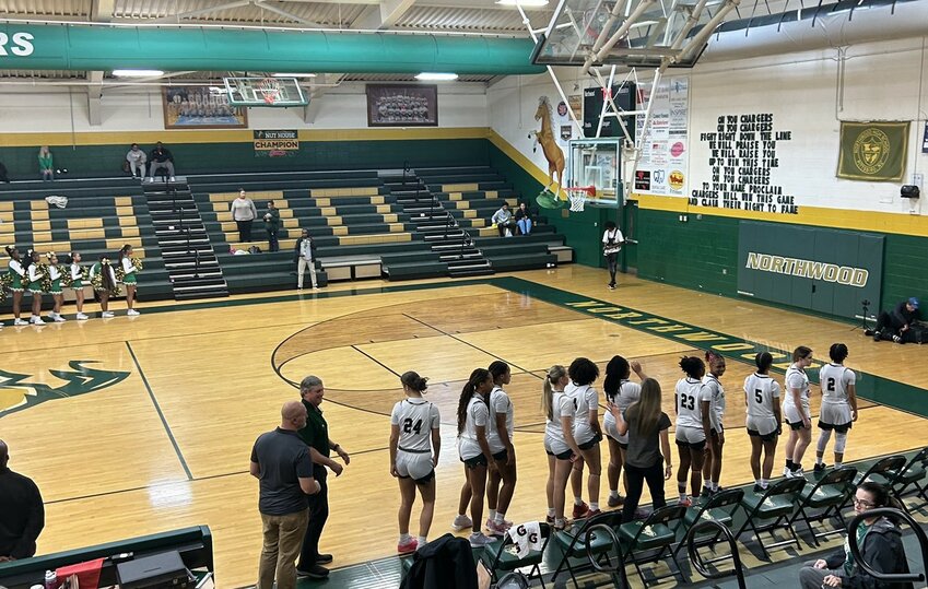 The Northwood girls&rsquo; basketball team lines up before its season opener against Williams.