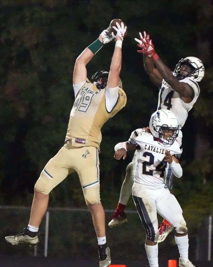 Gus Ritchey (19) goes up to make a catch in a game last season. Ritchey will be making plays for the Wolfpack starting next season.