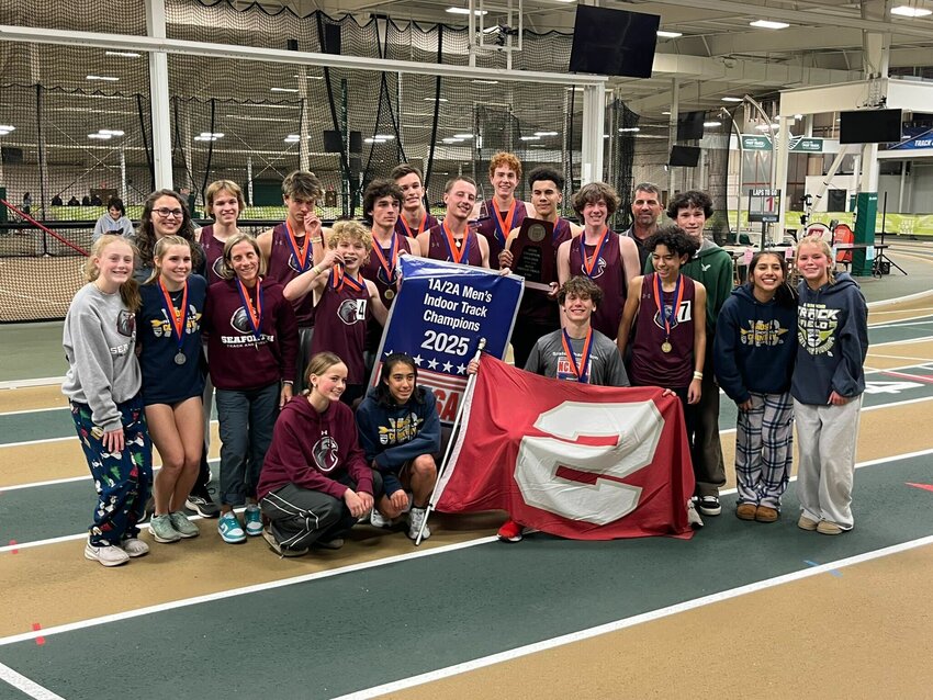 Seaforth's indoor track team poses with the championship banner.