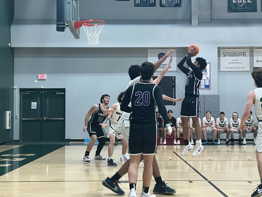 Chatham Charter&rsquo;s Gabe McKoy puts up a shot during a first-round playoff win over Woods Charter