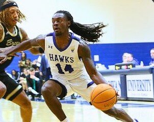 Northwood graduate Aaron Ross makes a dribble move during a January game for Chowan