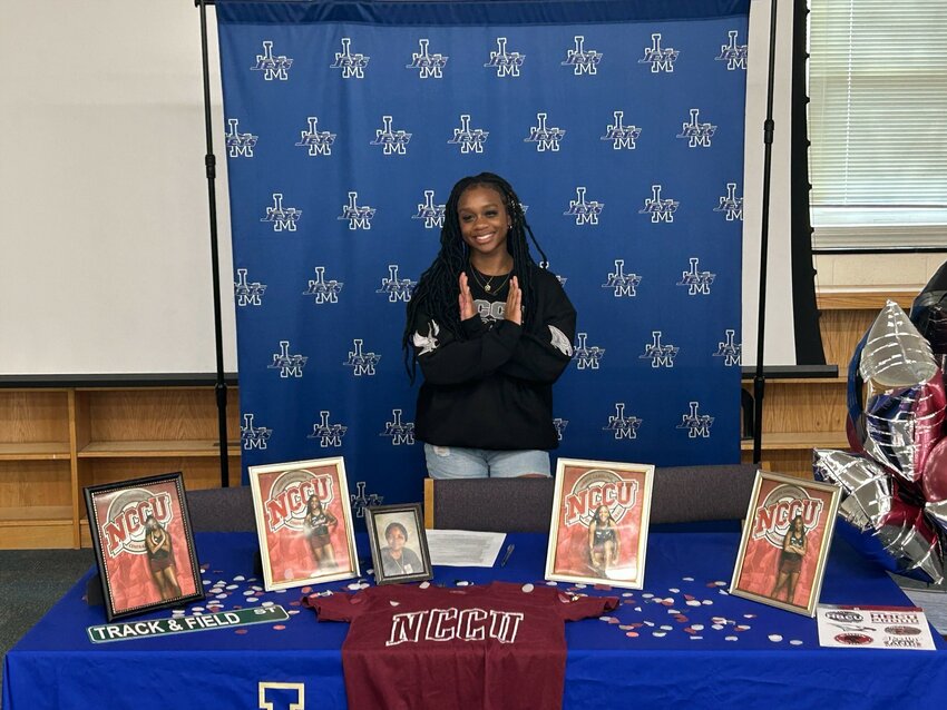Jordan-Matthews track &amp; field star Rachael Woods prepares to sign with NC Central at a ceremony at the school