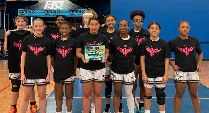 The 6th grade Carolina Magic team poses with their championship hardware after winning the LaMelo Ball invitational
