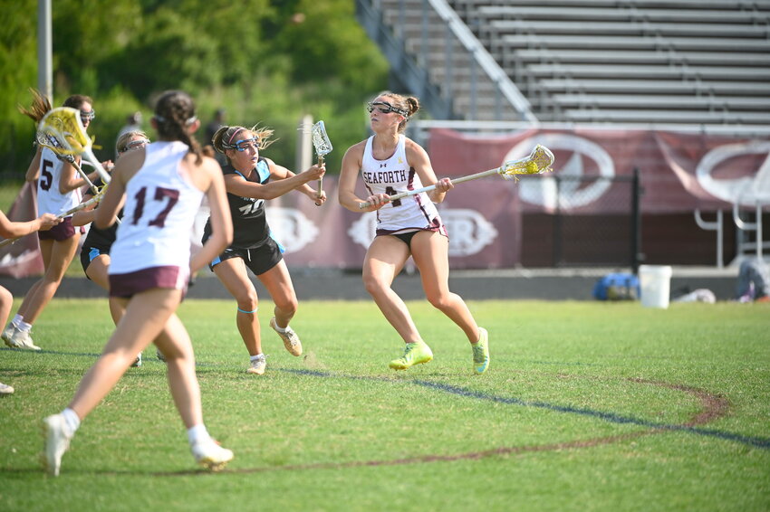 Natalie Boecke works her way through the Swansboro defense in the Hawks' playoff loss.