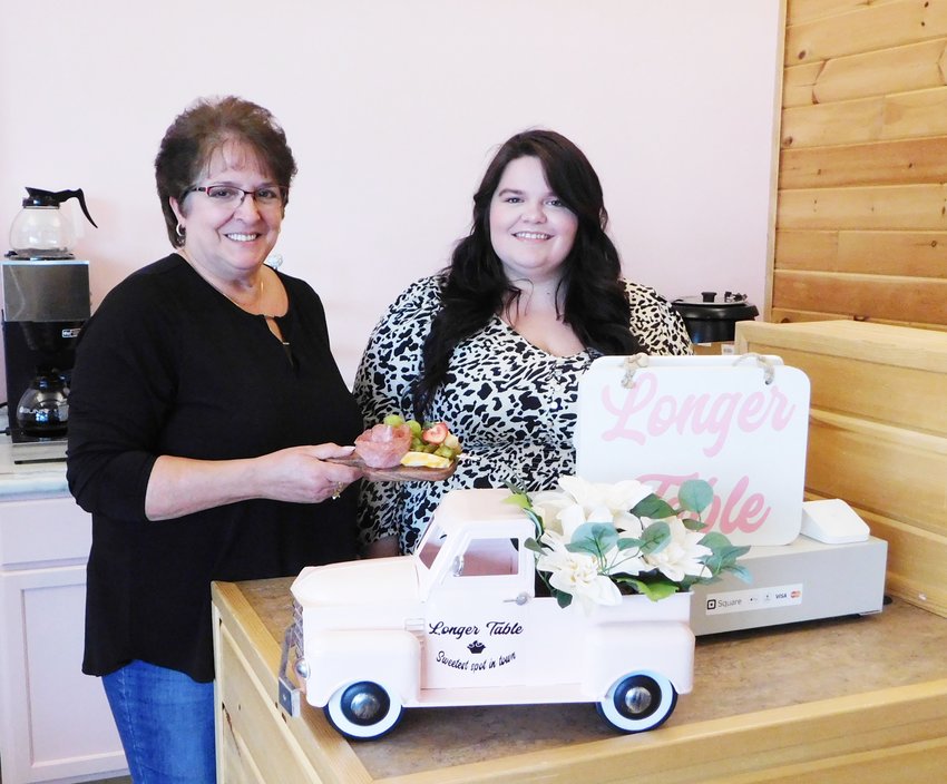 Tammy and Trisha Galloway, mother-daughter team behind Longer Table, display a bit of their product in the newly renovated storefront in the Harrison City Market.