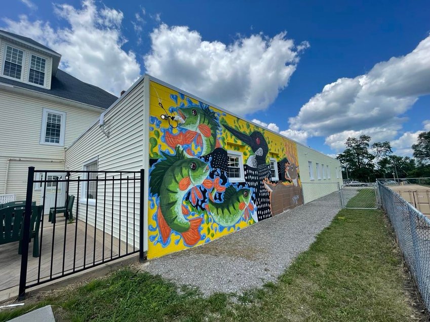 The nature themed mural on the east wall of the future Harrison District Library was painted by local artist Ian M. Humphres.