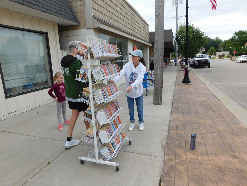 Many hands &ndash; and feet &ndash; take on the task of moving Harrison District Library&rsquo;s collection into its new home one block north on Second Street.