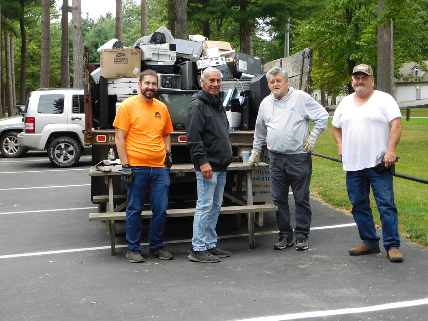 On hand once again at the electronics collection station are Justin Cavanaugh, Bob Buckley, Jesse McClaughry and Bob Hayward.