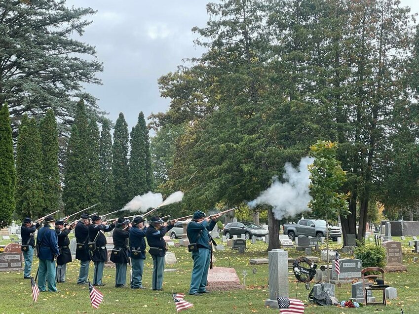 The honor guard of Camp 444 uses reproduction Civil War era rifles to perform the gun salute at Saturday&rsquo;s ceremony honoring Rev. William Younglove and Elias Riegle.