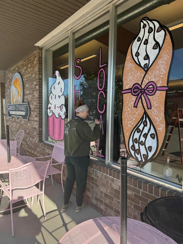 Longer Table&rsquo;s windows on Second Street in Harrison get an artist make-over by local artist Aliona Heber.