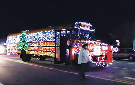 Auxilio drivers&rsquo; glittering, bedecked bus below won the Most Lights trophy.