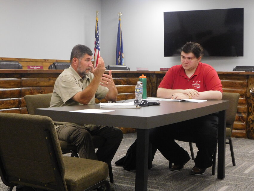 Commissioners Gabe Ambrozaitis, left, and George Gilmore disagree strongly as to the value and validity of the Clare County Airport and the county’s obligation to fund it, even minimally.