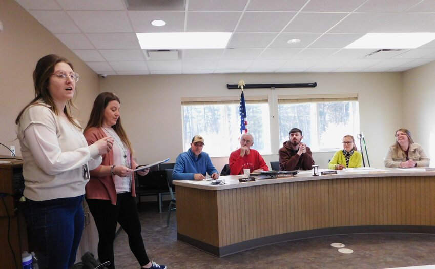 Pictured from left, Michala Wild, community outreach specialist with the Northern Michigan Alliance for Children, and Kasie Cooper, social worker at Harrison High School, describe the Community Fun Night planned for March 18 and the intention for additional such events in the near future.