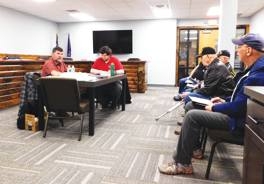 Commissioner Gabe Ambrozaitis, left, describes the process undertaken to certify and install current Clare County Administrator Lori Phelps as the interim airport manager for Clare County Airport 80D. Also pictured is Commissioner David Hoefling; Commissioner Rickie Fancon was absent. (Cleaver photo by Dianne Alward-Biery)