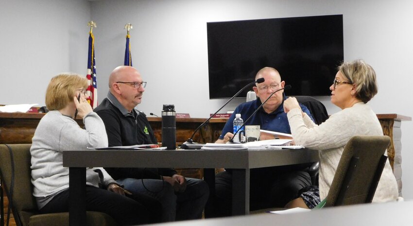 During the April 2 Clare County Board of Commissioners Policy Committee meeting, pictured from left, Marlene Housler, Rickie Fancon and George Gilmore listen as Clare County Administrator Lori Phelps describes various policies deemed to be in need of updating.
