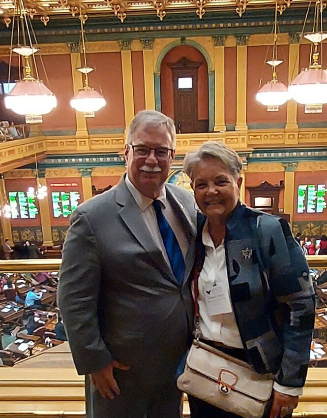 Pictured are John Roth, Representative of the 104th District, and Therese Haley, HCS Board of Education, at the Michigan state capital House Chamber.