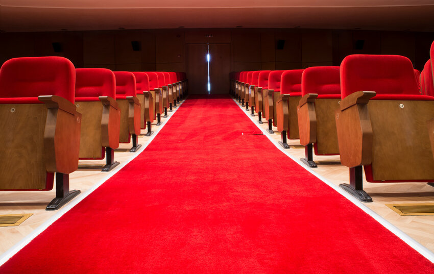 Red seats in a theater and an opera