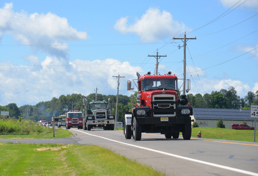 A convoy of Brockway trucks heads down Luker Road in Cortlandville in 2023 for the Brockway Truck Show. The event will return to the village of Homer for a third year this summer.