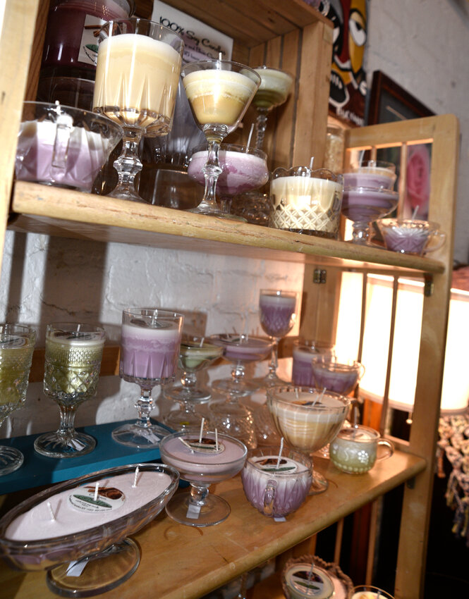 Candles created by Tammie Whitson, co-owner of Cinch Art Space, created using repurposed glassware.