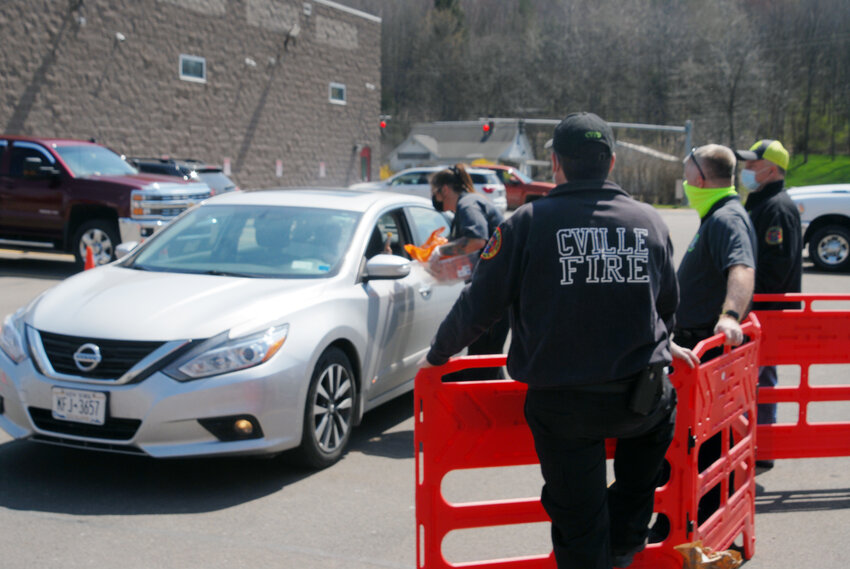Cortlandville firefighters assist in a drug take back program in 2021 at their main station on Route 13. The Cortland County Sheriff's Office has withdrawn from this year's event, citing Sheriff Mark Helms' disagreement with harm-reduction and safe-use messaging as part of the event.