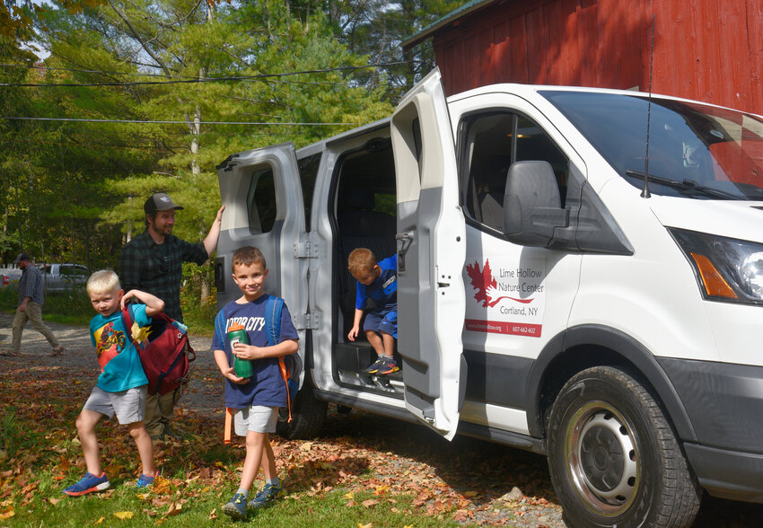 Students from Cassavant Elementary School in McLean get off the new Lime Hollow Nature Center van, which brings them to the outdoor after-school program.