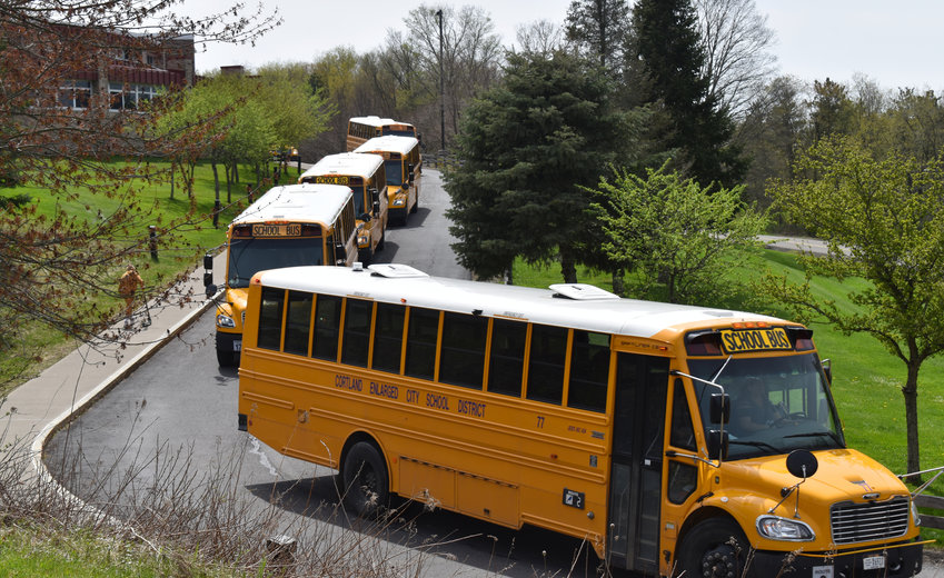 Cortland school buses leave Cortland High School in 2022 to take students home. Voters in all 10 school districts of the greater Cortland area will head to the polls Tuesday to decide the fate of budgets and other propositions.