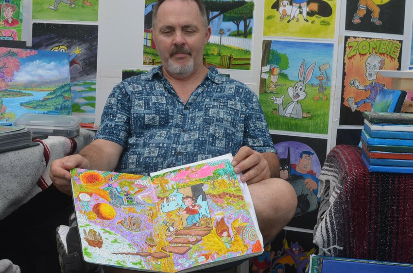 Cartoonist Jim Brenneman shows his work at the 2022 Arts Off Main in Cortland. The event returns Sunday to Court Street in Cortland.