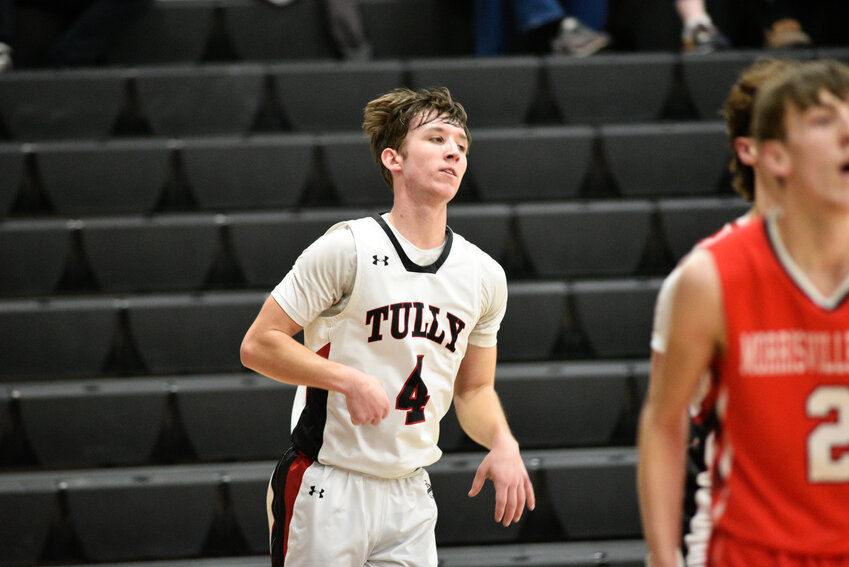 Tully's Lorenzo Garafolo looks back after making a 3-pointer Wednesday night at Tully High School.