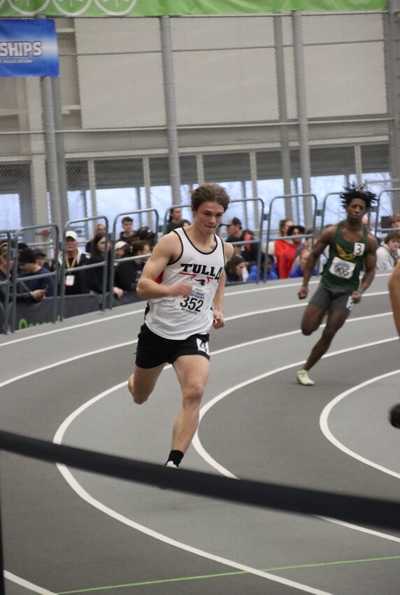 Tully’s Ryan Rauber, center, runs in the 300-meter dash Saturday at Ocean Breeze Athletic Complex. Rauber finished sixth in the federation and second in the public high school division while also breaking a Section III record.