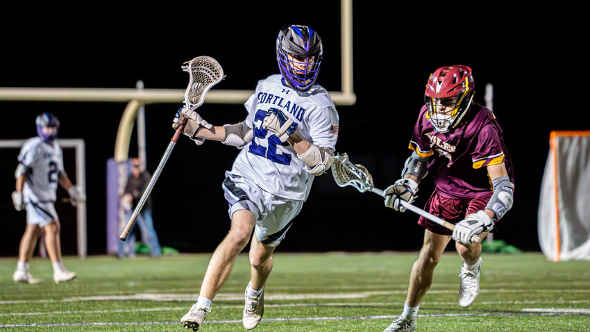 Cortland’s Joe Banewicz carries the ball up field against Whitney Point Tuesday at Cortland Junior-Senior High School. Banewicz had three goals in the Purple Tigers’ 9-5 loss.