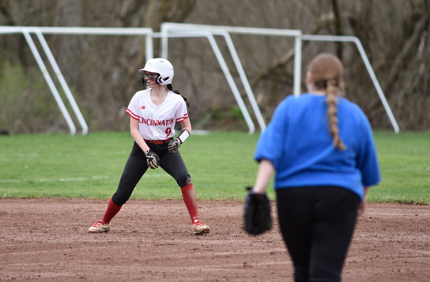 Cincinnatus' Rachael Standish, left, leads off second base after a pitch Friday at Cincinnatus Central School. Standish went 2-for-3 with two walks and four runs scored in the Lions' 25-3 win.