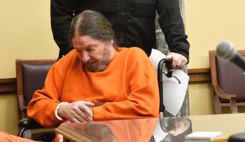 Steven Burda sits in court Thursday during a hearing.  Cortland County Court judge Julie Campbell said the case against Burda has much evidence to consider. Burda is accused of the attempted murder of four police officers.