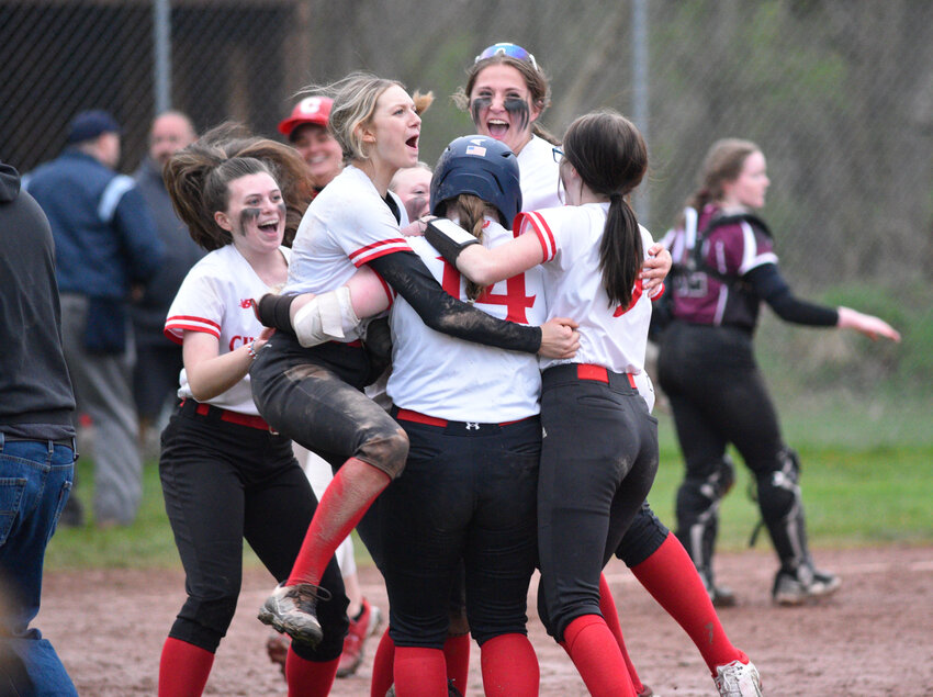 The Cincinnatus softball team celebrates after Kayle Brenchley, No. 14, hit a walk-off single Friday at Cincinnatus Central School. The Lions beat Stockbridge Valley 6-5.
