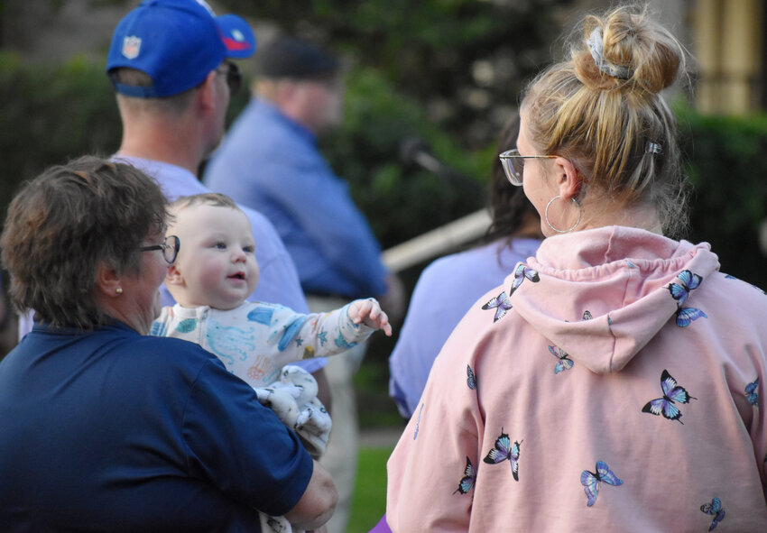 Orion Walling, 6 months, reaches for his mother, Rebekah Walling of McGraw, from the arms of his grandmother, Cindy Hayes at an opioid vigil last August that won Managing Editor Todd R. McAdam a prize from the Syracuse Press Club for best photo essay.