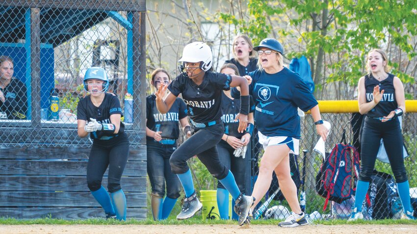 Moravia’s Lashley Heredia-Castillo, front, runs toward home plate to complete an inside-the-park home run against Dryden Monday at Moravia Central School. Heredia-Castillo went 2-for-3 with two RBIs, two runs and three steals in the Blue Devils’ 11-9 win.