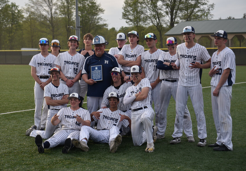 The Homer baseball team poses with head coach Robert Nasiatka, center, after his 200th career win Tuesday at Gutchess Lumber Sports Complex.
