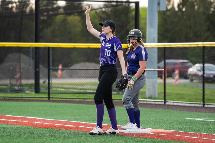 Cortland’s Claire Turner, left, calls out how many outs there are Tuesday at Gutchess Lumber Sports Complex. Turner hit a three-run triple in Cortland’s 5-3 win.