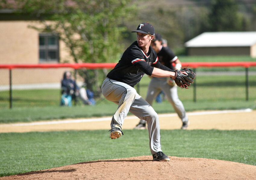 Tully's Zeke Mohat delivers a pitch Wednesday at Tully High School. Mohat went all seven innings and had the game-winning hit in the Black Knights' 5-4 win.