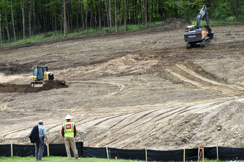Joe Sovocool of Family Health Network, left, chats Thursday with Eric Metzger, a project supervisor for Hayner Hoyt, which is prepping a site on Route 281 in Homer for Family Health Network's Homer Family Practice.