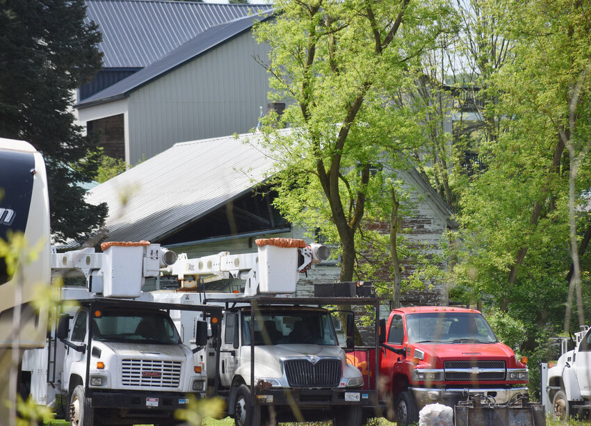 Several trucks with Carter's Tree Service sit on a lot on Route 215 in Cortlandville, a lot zoned R-1 residential. The company says it has been given until September to comply with town zoning ordinance.