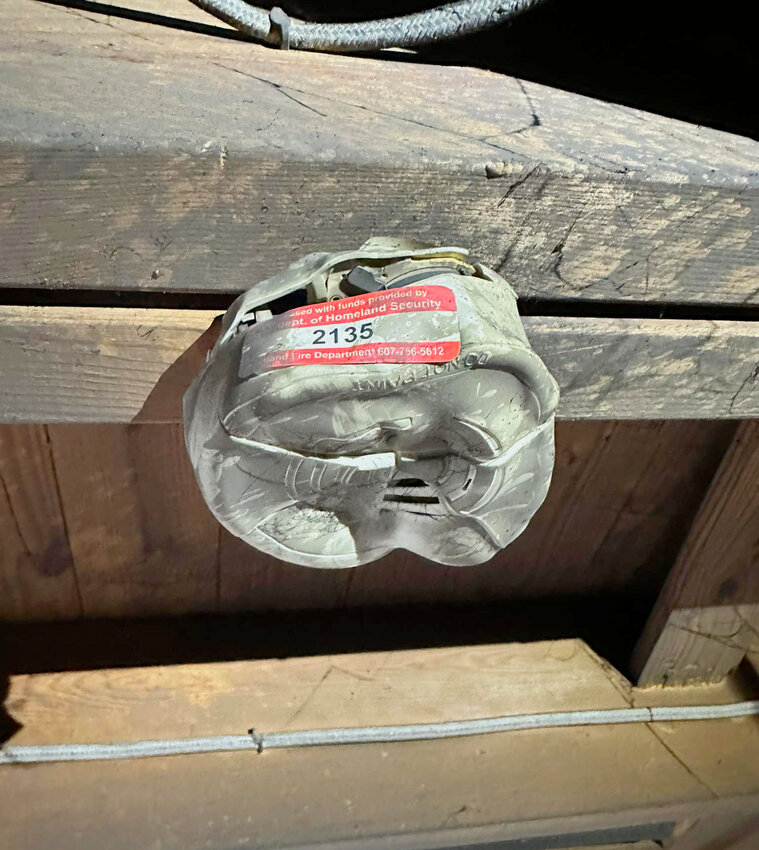 Cortland firefighters say this smoke detector they installed several years ago in the basement of a home at 3 Cowance St. gave an early warning to a fire Wednesday morning, helping limit damage.