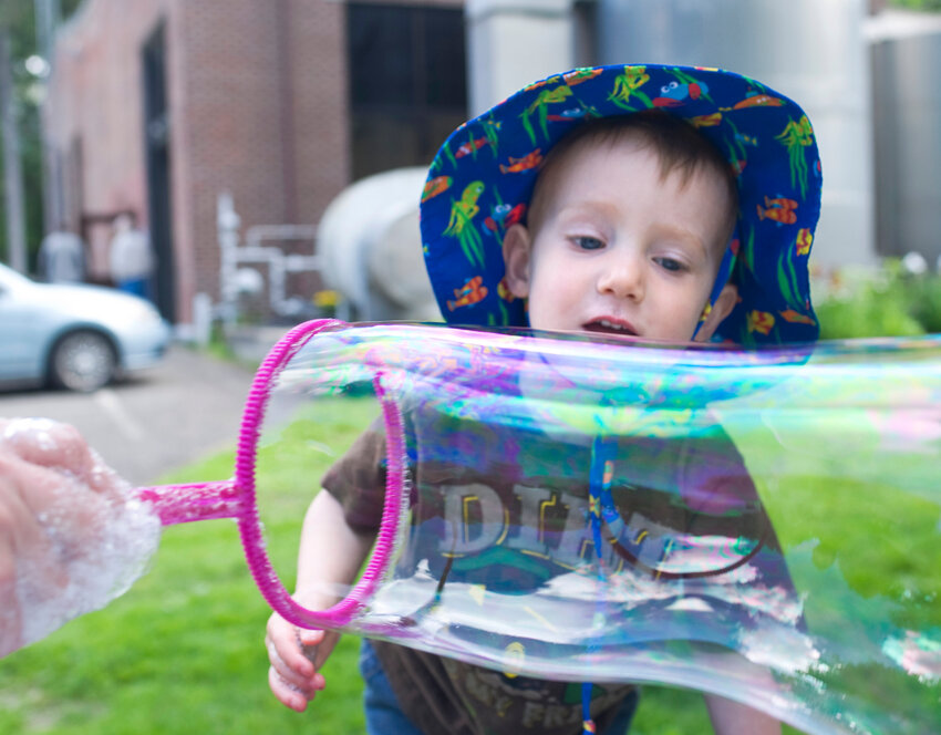 Bruce Thauvette, 2, of Cortland, helps make bubbles at the 2017 Cortland County Water Festival at the Water Works in Cortland. The event returns Saturday.