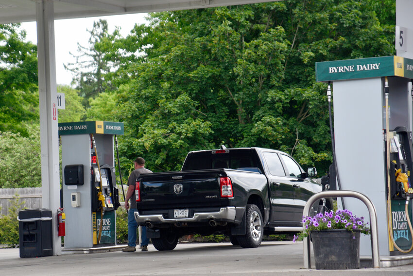 A man fills his Dodge pickup Tuesday at the Byrne Dairy in Homer. Gas prices now, about $3.67 a gallon, are lower than two years ago, although they've drifted up over the past few years. Still, the prices are down about 2 cents a gallon from last week.